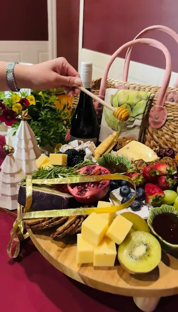 A classic grazing board with cheese, fruit, dips and crackers